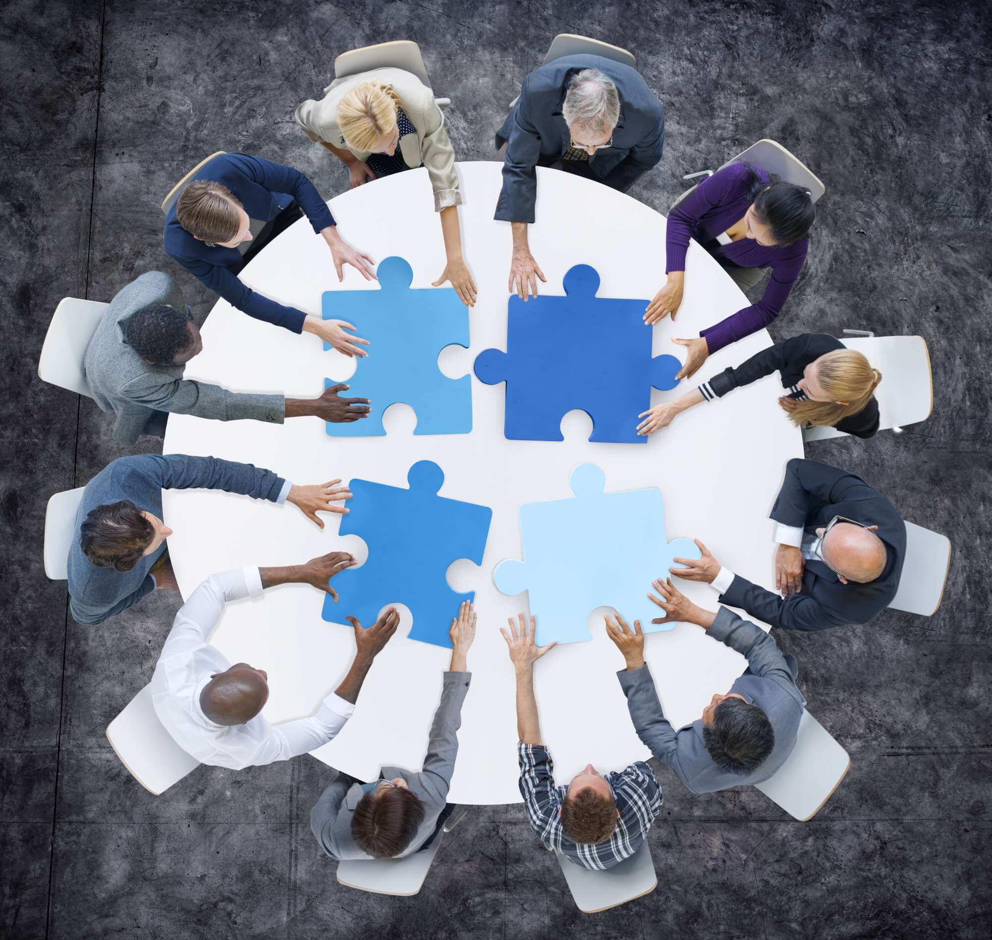 Business People and Jigsaw Puzzle Pieces